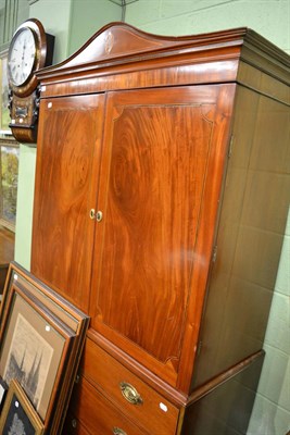 Lot 1299 - An inlaid mahogany linen press