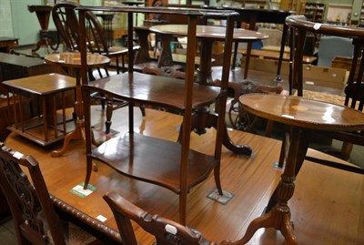 Lot 1320 - An Edwardian three tier mahogany whatnot, mahogany table top revolving book stand and a pair of...