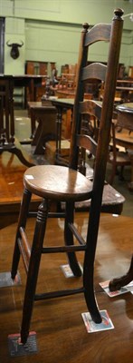 Lot 1335 - A 19th century oak ladder back correction chair