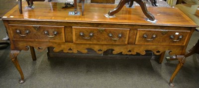 Lot 1337 - Walnut dresser base fitted three drawers