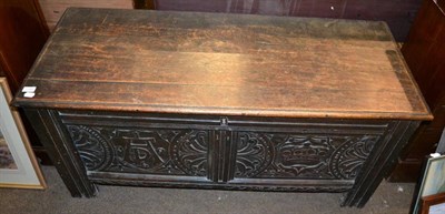 Lot 1345 - An 18th century carved oak coffer