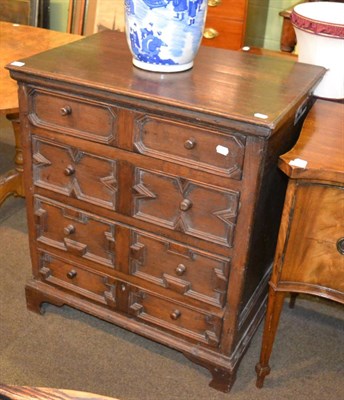 Lot 1350 - An 18th century carved oak four height chest of drawers