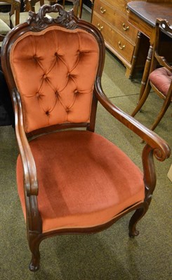 Lot 1363 - A Victorian carved mahogany button back armchair