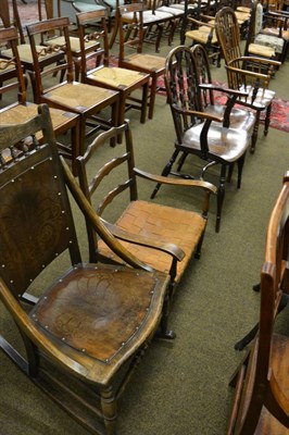 Lot 1368 - An open elm Windsor armchair, two oak Windsor style chairs, an early 20th century oak rocking chair