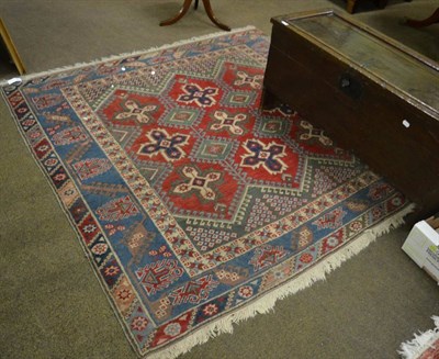 Lot 1372 - A Yagibedir rug of unusual size, West Anatolia, the claret field with rows of cruciform guls...