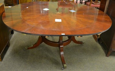 Lot 1378 - A reproduction mahogany Jupe style dining table, inlaid with an oak and ebony sun burst emblem with