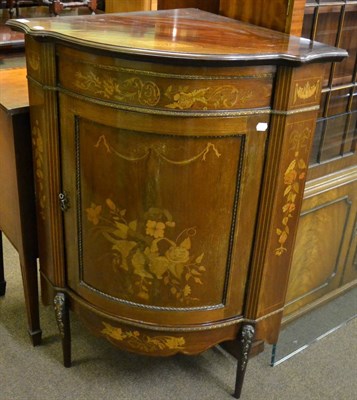 Lot 1385 - An Edwardian marquetry inlaid mahogany bow fronted, gilt metal mounted low corner cabinet