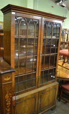 Lot 1386 - A reproduction glazed mahogany bookcase cabinet