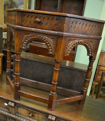 Lot 1396 - A Titchmarsh & Goodwin style oak side table together with a similar sideboard (2)