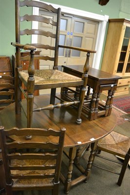 Lot 1397 - Reproduction oak gate leg dining table, together with a set of five rush seated ladder back...