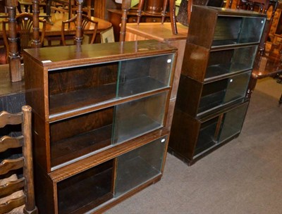 Lot 1398 - A 1920's oak three tier bookcase by Minty, together with a matching four tier example (2)