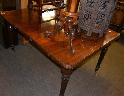 Lot 1399 - A Victorian mahogany wind-out dining table