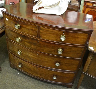 Lot 1414 - A George III mahogany bow fronted four height chest of drawers