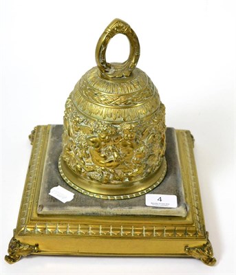 Lot 4 - A brass bell on stand