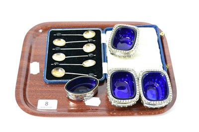 Lot 8 - A cased set of silver teaspoons, three silver salts with blue glass liners and another of oval...