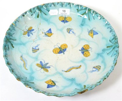 Lot 16 - Possibly 18th century tin glaze bowl with scalloped edge, decorated with insects in yellow and blue