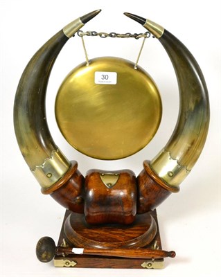 Lot 30 - A late Victorian oak and ox horn dinner gong and beater