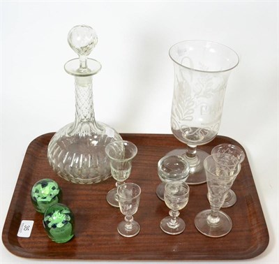 Lot 35 - A glass celery vase, six small glasses, a glass decanter and a pair of Victorian paperweights