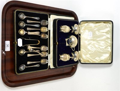 Lot 36 - A set of twelve silver spoons and matching tongs together with a silver five piece condiment set