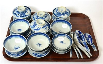 Lot 45 - A set of Chinese blue and white rice bowls, covers, stands and spoons, Qing dynasty