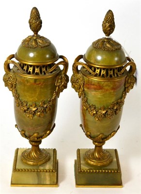 Lot 52 - A pair of French green onyx urns with ormolu mounts