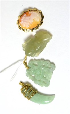 Lot 68 - Three jade pendants with gold mounts and a cameo brooch with rolled gold mount (4)