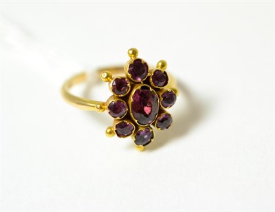 Lot 76 - A garnet cluster ring (adapted)