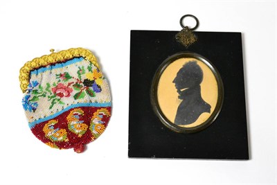 Lot 94 - A bead work purse and an early 19th century framed silhouette (2)
