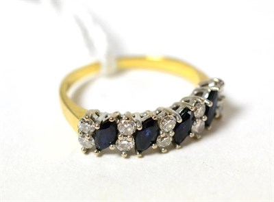 Lot 98 - An 18ct gold sapphire and diamond half hoop ring