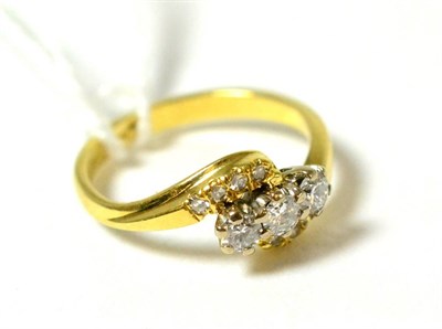 Lot 113 - A diamond three stone twist ring