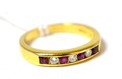 Lot 115 - An 18ct gold ruby and diamond seven stone ring