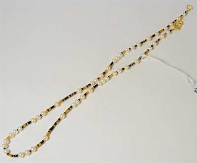 Lot 121 - A cultured pearl, spessartite garnet and sapphire necklace, the cultured pearls strung with faceted