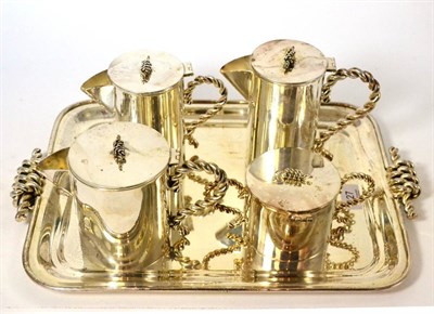 Lot 127 - A white metal five piece tea service comprising tray, teapot, hotwater jug, sugar bowl and...