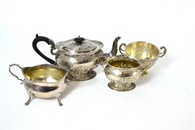 Lot 130 - A silver teapot and matching sugar basin, Birmingham, together with two further sugar basins,...