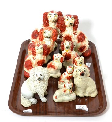 Lot 140 - A pair of Staffordshire spaniels, others smaller, poodle group, etc (11)