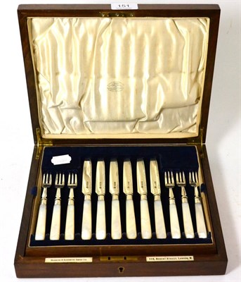 Lot 151 - A set of twelve silver and mother-of-pearl handled dessert knives and forks in a mahogany case,...