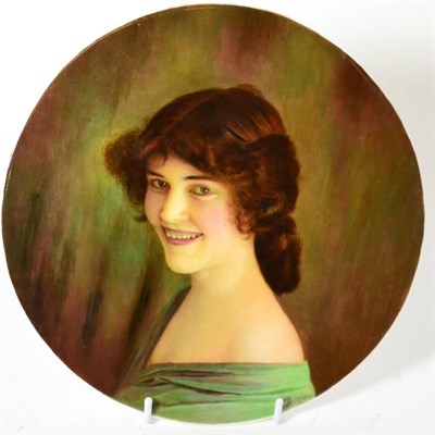 Lot 163 - A circular porcelain plaque hand painted with portrait of a lady by James Edwin Dean