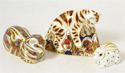 Lot 203 - Royal Crown Derby Bengal tiger cub, another of a sleeping cat and a blue and gilt decorated...