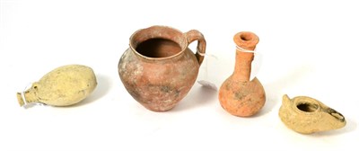 Lot 212 - A Roman terracotta jug 3rd/5th century AD, 10cm high, together with a Roman terracotta oil lamp...