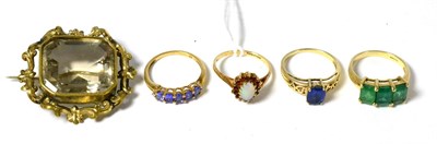 Lot 242 - Four 9ct gold dress rings and a Victorian brooch