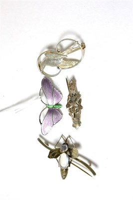 Lot 243 - A purple and green enamelled butterfly brooch, a silver bird brooch (Shetland), a moonstone bug...