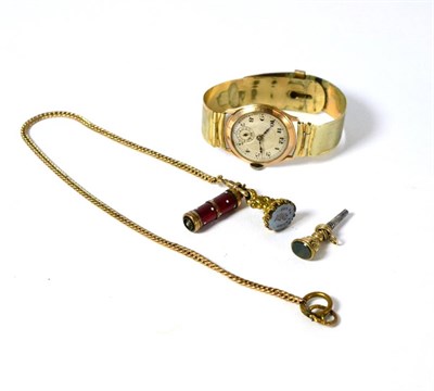 Lot 276 - A 9ct gold wristwatch, gilt metal fob, seal with attached enamel pencil and an agate set watch key