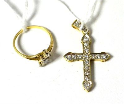 Lot 280 - A diamond three stone twist ring and a 9ct cross pendant set with cubic zirconia