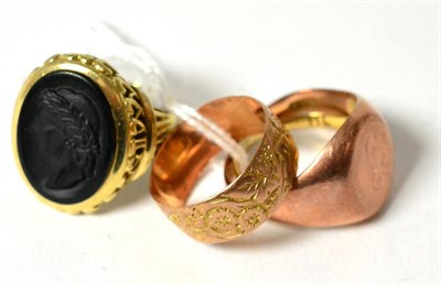 Lot 295 - Three signet rings and a band ring