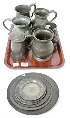 Lot 311 - 18th century and later pewter including eight chargers and plates, seven tankards and a pepperette