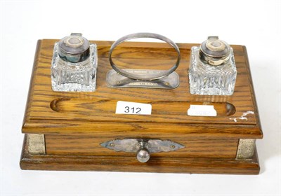 Lot 312 - An oak desk two bottle inkwell standish with silver mounts