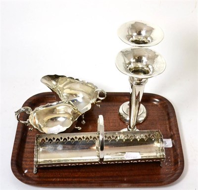 Lot 316 - A pierced silver basket, two silver sauce boats and two silver bud vases