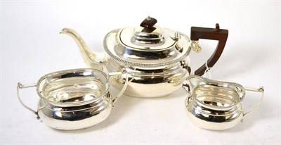 Lot 318 - A silver three piece tea set