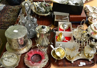 Lot 338 - A quantity of plated ware, a biscuit barrel, teapot, toast racks, flatware etc (on four trays)