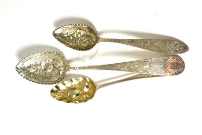 Lot 354 - Three silver berry spoons, one London George III, one German and one marked Burgari (3)